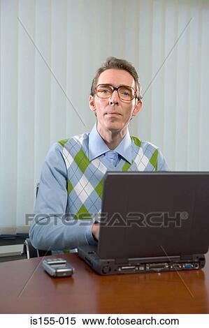Office worker using laptop computer View Large Photo Image Stock Photography - Office worker using laptop computer. Fotosearch
