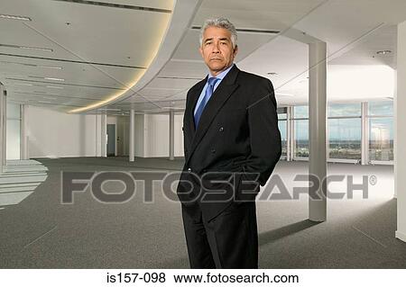 Stock Photo - Businessman in empty office. Fotosearch