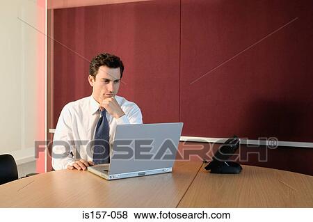 Businessman in office View Large Photo Image Stock Photo - Businessman in office. Fotosearch