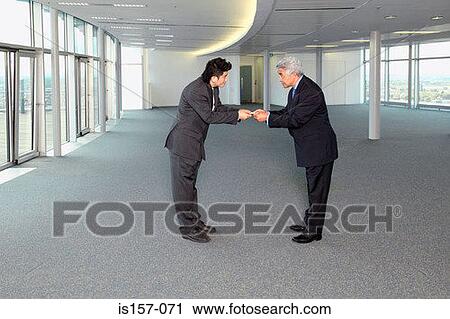 Businessmen exchanging business cards View Large Photo Image Stock Image - Businessmen exchanging business cards. Fotosearch