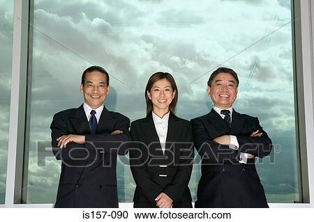 Stock Image - Businesspeople and cloudy sky. Fotosearch