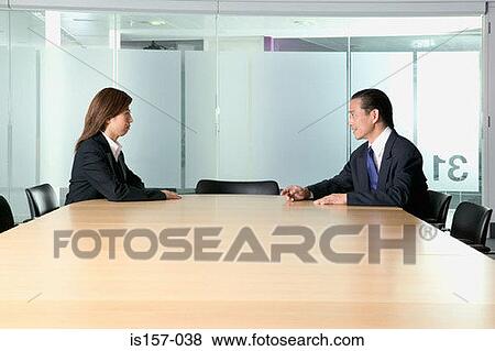 Businesspeople in conference room View Large Photo Image Stock Photo - Businesspeople in conference room. Fotosearch