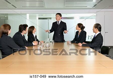 Stock Photo - Businesspeople in conference room. Fotosearch