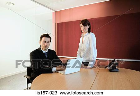 Businesspeople in office View Large Photo Image Stock Image - Businesspeople in office. Fotosearch