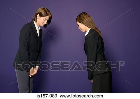 Stock Photo - Busineswomen bowing. Fotosearch