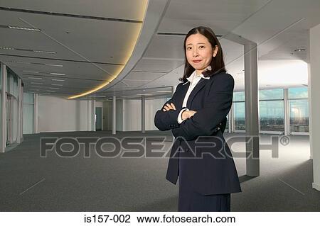 Stock Image - Serious looking businesswoman. Fotosearch