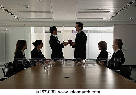 Silhouetted businesspeople in conference room View Large Photo Image Stock Image - Silhouetted businesspeople in conference room. Fotosearch