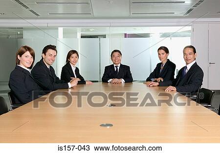 Smiling businesspeople in conference room View Large Photo Image Stock Image - Smiling businesspeople in conference room. Fotosearch