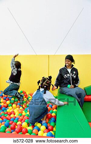 Children playing in ball pool View Large Photo Image Stock Photo - Children playing in ball pool. Fotosearch