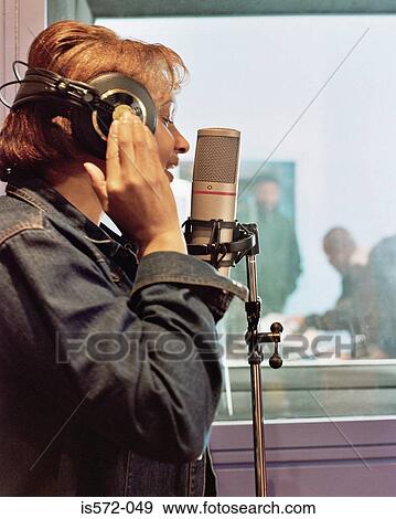 Female singer in recording studio View Large Photo Image Stock Photo - Female singer in recording studio. Fotosearch