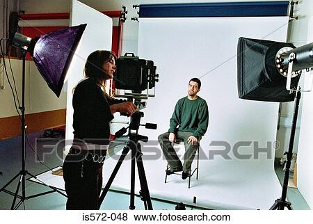 Photographer in studio View Large Photo Image Stock Photo - Photographer in studio. Fotosearch