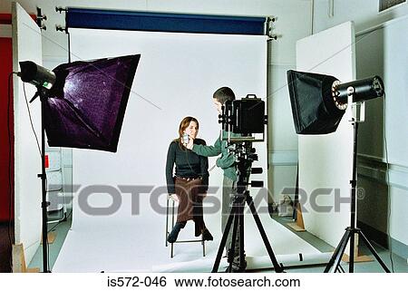 Stock Photograph - Photographer in studio. Fotosearch