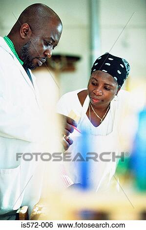 Stock Photograph - Student in laboratory. Fotosearch