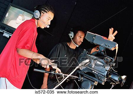 Stock Photography - Two cameramen. Fotosearch