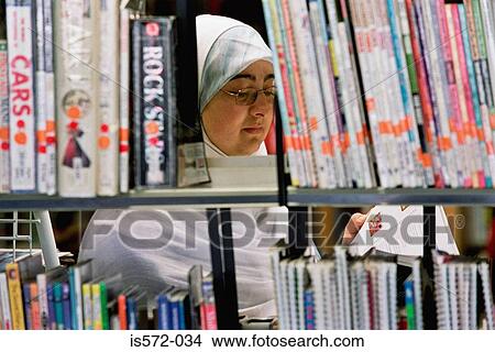 Woman reading in library View Large Photo Image Picture - Woman reading in library. Fotosearch