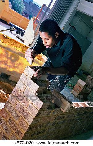 Young bricklayer View Large Photo Image Stock Image - Young bricklayer. Fotosearch