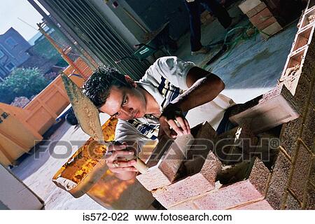 Young bricklayer View Large Photo Image Stock Image - Young bricklayer. Fotosearch