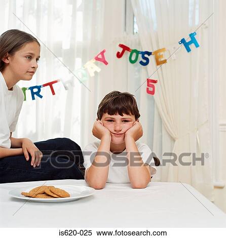 Boy and girl at birthday party View Large Photo Image Stock Photography - Boy and girl at birthday party. Fotosearch