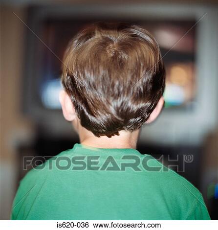 Boy watching television View Large Photo Image Stock Photograph - Boy watching television. Fotosearch