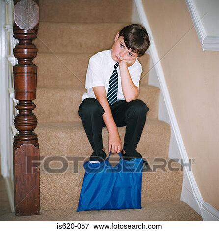 Stock Photo - Child sitting on stairway. Fotosearch