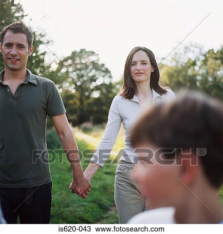 Family walking in field View Large Photo Image Stock Image - Family walking in field. Fotosearch