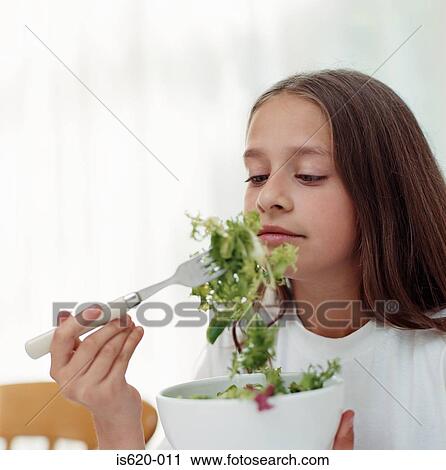 Girl eating salad View Large Photo Image Stock Image - Girl eating salad. Fotosearch