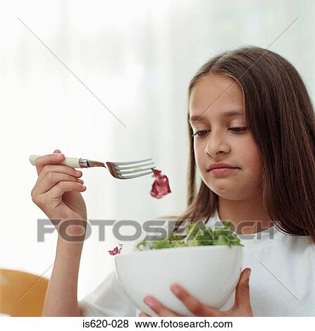 Girl holding a bowl of salad View Large Photo Image Stock Photo - Girl holding a bowl of salad. Fotosearch