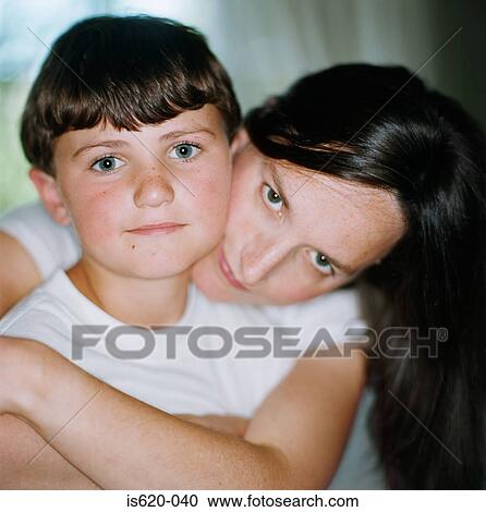 Mother hugging her son View Large Photo Image Stock Image - Mother hugging her son. Fotosearch