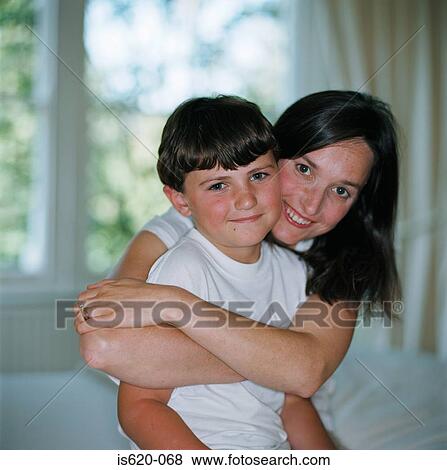 Mother hugging her son View Large Photo Image Stock Photo - Mother hugging her son. Fotosearch