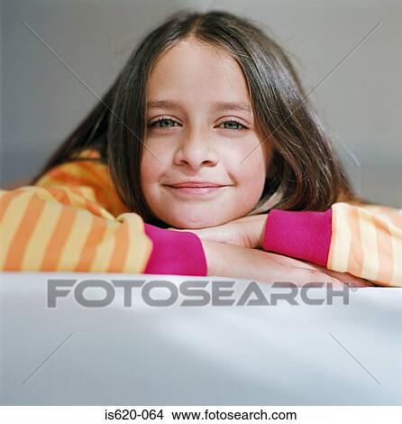Portrait of a girl wearing a striped sweater View Large Photo Image Picture - Portrait of a girl wearing a striped sweater. Fotosearch