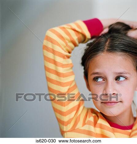 Portrait of a girl wearing a striped sweater View Large Photo Image Stock Image - Portrait of a girl wearing a striped sweater. Fotosearch