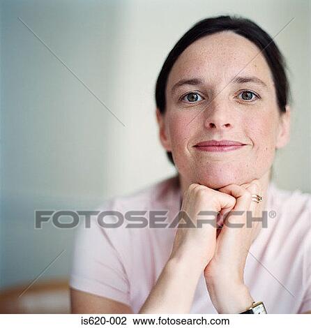 Stock Image - Portrait of a smiling woman. Fotosearch