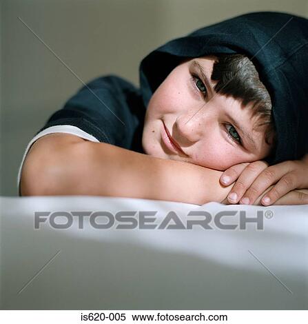 Smiling boy wearing a hood View Large Photo Image Stock Photography - Smiling boy wearing a hood. Fotosearch