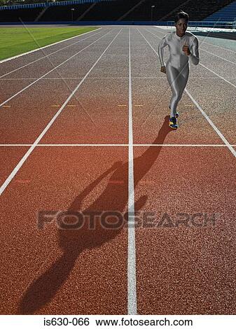 Female runner on race track View Large Photo Image Stock Photograph - Female runner on race track. Fotosearch