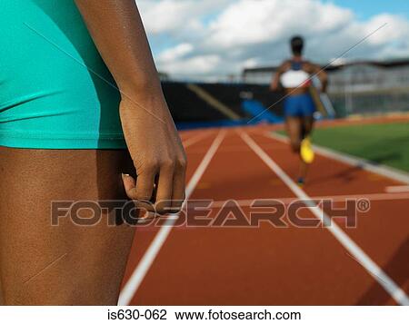 Female runners on race track View Large Photo Image Stock Image - Female runners on race track. Fotosearch