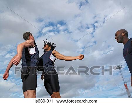 Male athletes celebrating View Large Photo Image Stock Image - Male athletes celebrating. Fotosearch