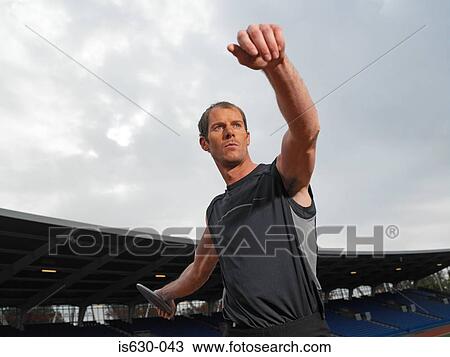 Male discus thrower View Large Photo Image Stock Image - Male discus thrower. Fotosearch