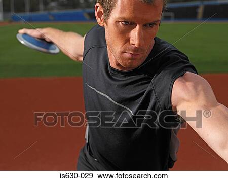 Male discus thrower View Large Photo Image Stock Photo - Male discus thrower. Fotosearch