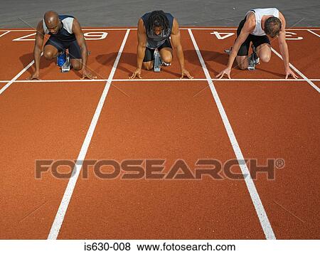 Male runners at starting line View Large Photo Image Stock Photo - Male runners at starting line. Fotosearch