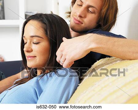 Stock Image - Man stroking womans hair. Fotosearch