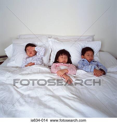 Children asleep in bed View Large Photo Image Picture - Children asleep in bed. Fotosearch