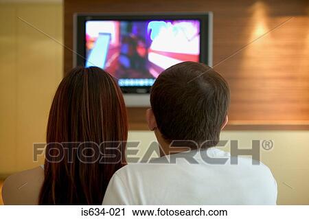 Couple watching television View Large Photo Image Stock Image - Couple watching television. Fotosearch