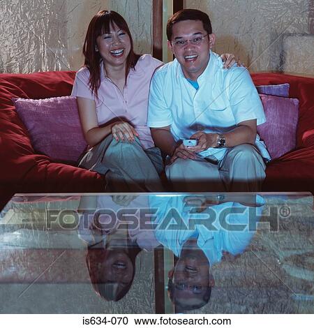 Couple watching television View Large Photo Image Stock Image - Couple watching television. Fotosearch
