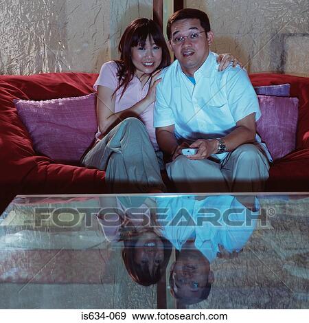 Couple watching television View Large Photo Image Stock Photo - Couple watching television. Fotosearch
