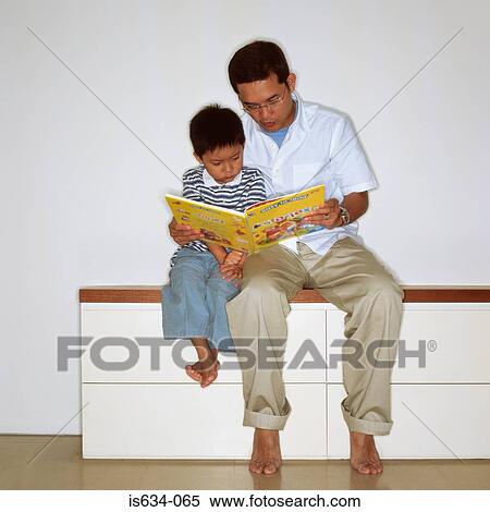 Father reading with son View Large Photo Image Stock Photography - Father reading with son. Fotosearch