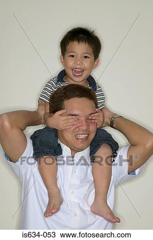 Father shoulder carrying son View Large Photo Image Stock Image - Father shoulder carrying son. Fotosearch