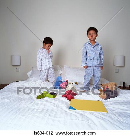 Unhappy young boys at bedtime View Large Photo Image Stock Image - Unhappy young boys at bedtime. Fotosearch