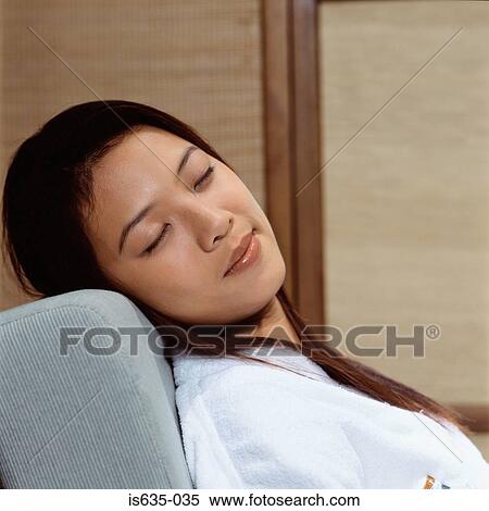 Asian woman sleeping in armchair View Large Photo Image Stock Photography - Asian woman sleeping in armchair. Fotosearch