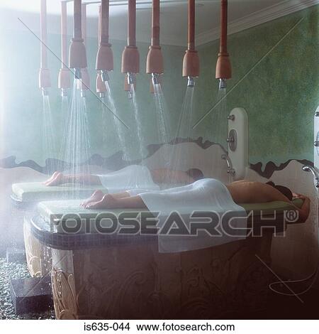 Picture - People showering in spa. Fotosearch