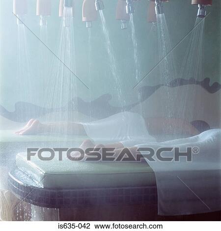 People showering in spa View Large Photo Image Stock Image - People showering in spa. Fotosearch